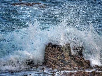 Waves splashing on rocks