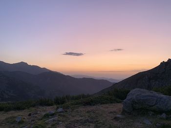 Scenic view of silhouette mountains against sky during sunset