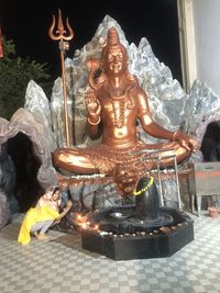 Sculpture of buddha outside building