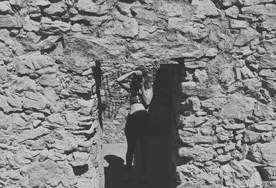 High angle view of woman standing on rock