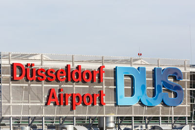 Low angle view of information sign against clear sky