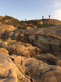 People standing on cliffs and rocks