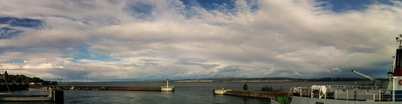 water, sky, cloud - sky, cloudy, waterfront, sea, cloud, scenics, weather, tranquility, built structure, nature, beauty in nature, river, tranquil scene, overcast, storm cloud, architecture, lake, outdoors