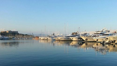 Boats moored at harbor