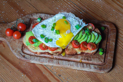 High angle view of egg sandwich on cutting board