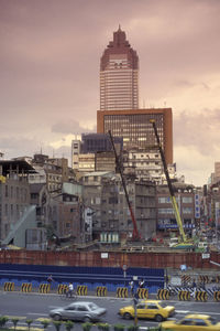 View of modern buildings against sky during sunset