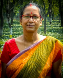 Low section of man standing in forest