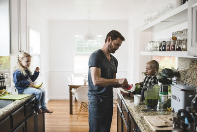 Man and woman standing at home