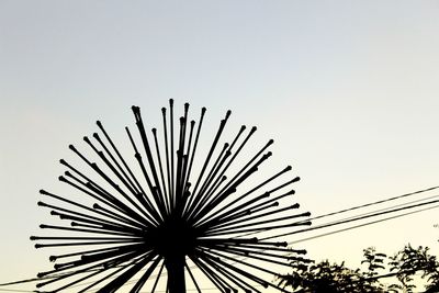 Low angle view of palm tree against sky