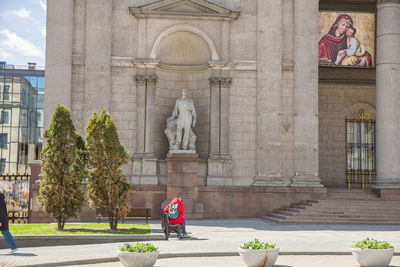 People in front of historic building