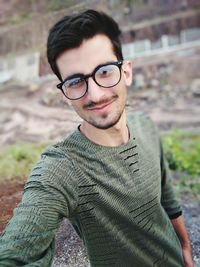 Portrait of young man wearing eyeglasses