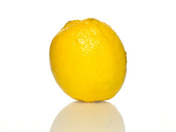 Close-up of lemon against white background