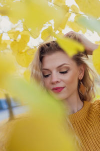 Portrait of young woman with yellow eyes