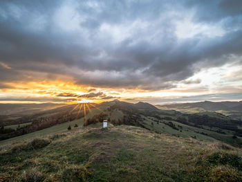 Scenic view of landscape against sky during sunset