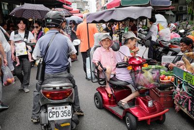 People on street market in city