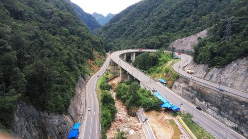 High angle view of road amidst mountains