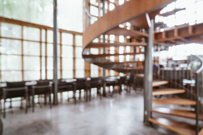 Empty chairs and tables in restaurant