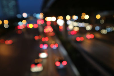 Defocused image of illuminated lights at night