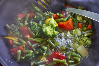 Close-up of chopped vegetables in cooking pan