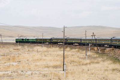 Train on field against sky