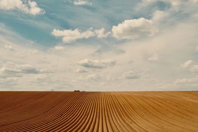 Scenic view of plowed field