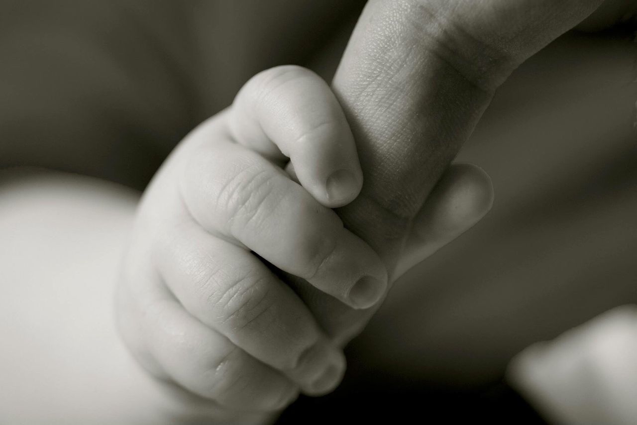 person, part of, indoors, human finger, baby, close-up, bonding, unknown gender, togetherness, family with one child, love, lifestyles, cropped, holding, childhood