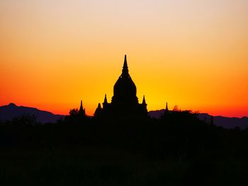 Silhouette of church against sky during sunset