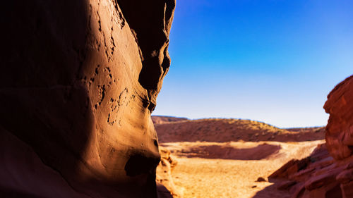 Rock formations in desert against sky