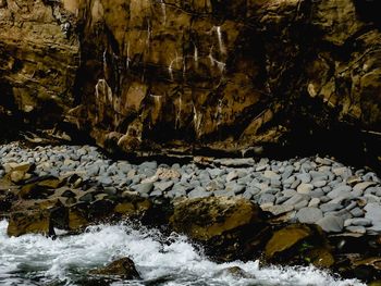 Close-up of rock formation in water