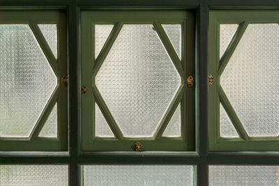 Directly below shot of vintage glass window in building