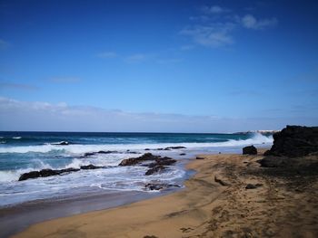 Scenic view of beach against sky