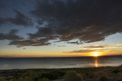 Scenic view of sea against sky during sunset