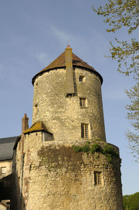 Low angle view of old building against sky