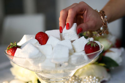 Close-up of hand holding ice cream