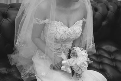 Close-up of hand holding bouquet