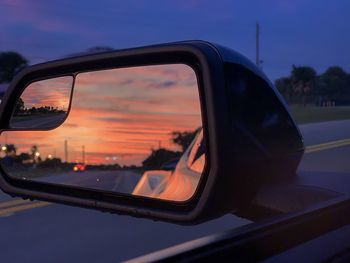 Reflection of sky on side-view mirror