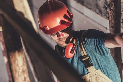 Close-up of worker working at industry