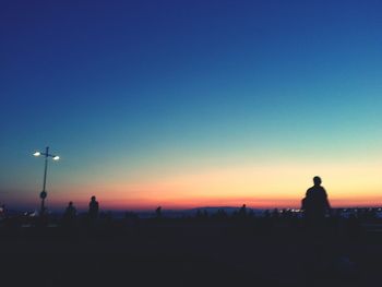 Silhouette of people at sunset