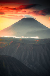 Scenic view of mountains against sky during sunset