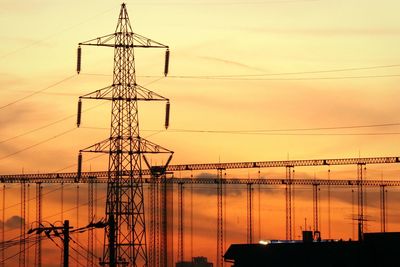 Low angle view of electricity pylon against sky