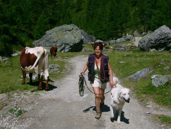 Portrait of woman with white great dog