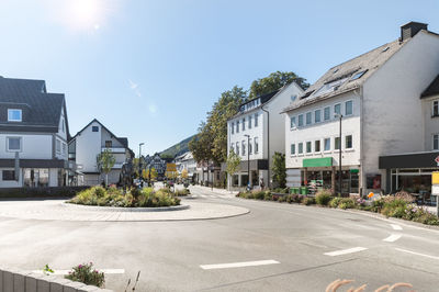 In olsberg a new roundabout was built. in the middle stands a statue of a caster. wide angle