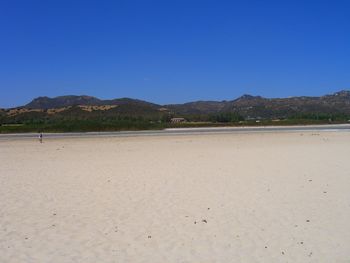 Scenic view of mountains against clear blue sky