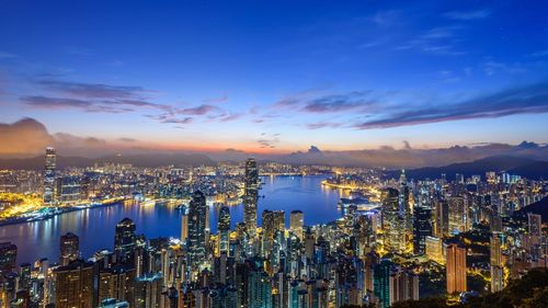 High angle view of city lit up at night