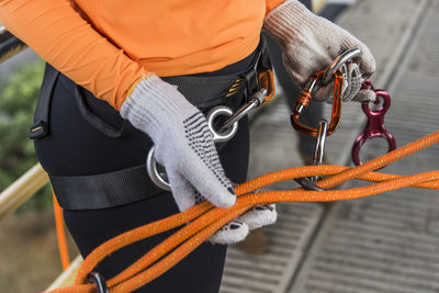 Rappel practitioners preparing the equipment to perform the activity next. salvador bahia brazil.