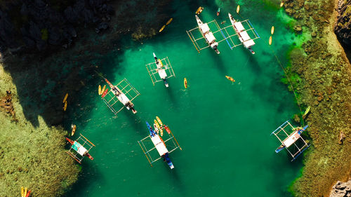 Tourist boats over tropical lagoon and coral reef. small lagoon with turquoise water. el nido