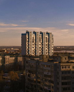 High angle view of buildings against sky at sunset