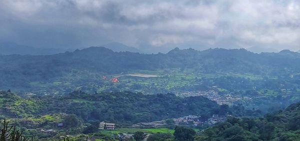 Aerial view of mountains against sky