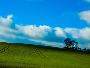 Scenic view of landscape against cloudy sky