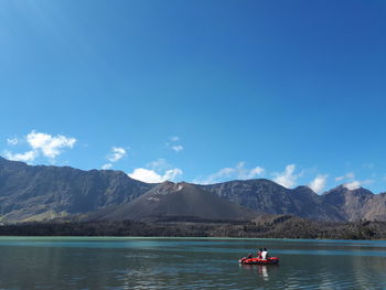 Scenic view of lake against blue sky